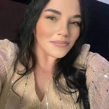 Man helps woman in snow near store