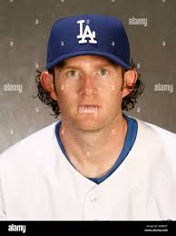 Los Angeles Dodgers pitcher Tim Belcher reacts as Oakland A's Jose Canseco  rounds the bases, background, after slugging a second inning grand slam in  the first game of the World Series at