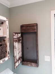 From party door covers to holidays. My Hubby Made This Sweet Distressed Door Cover For The Electrical Panel In Our Laundry Room Primitive Laundry Rooms Laundry Room Makeover Home Diy
