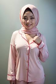Malay girl in hijab wearing sexy pastel color pajamas portrait photography  - SeaArt AI