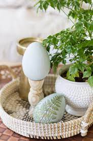 Nests, eggs, young flowers, and greenery. Spring Coffee Table Styling With A Diy Easter Pedestal Egg Zevy Joy