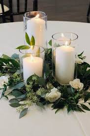 The larger of the two candleholders is 5.75 inches wide by 5.75 inches deep by 9.375 inches tall, while the smaller candle holder is 5.375 inches wide by 5.375 inches deep by 7.25 inches tall. Cylinder Hurricane Vases With Pillar Candles Coastal Classy Events Design