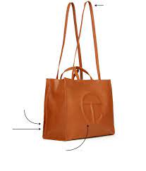 The strap on this bag was so long that you had to knot it on top so it wouldn't drag on the ground beside you. An It Bag That Broke Fashion S Rules Wsj