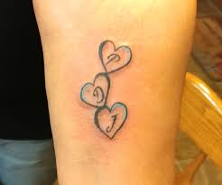 My Sister Had The First Initial Of Each Of Her Three Boys Put In The Hearts Mom Tattoos Tattoos For Daughters Tattoos For Kids