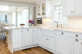 A Beach Cottage Kitchen Cabinetry Woodmode Brookhaven Cabinets With Nordic White Finish White Kitchen Remodeling Kitchen Remodel Photos White Cottage Kitchens