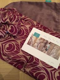 What does this product provide? Artipoppe Argus Lucy Wrap Silk Wool