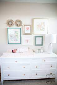 Nursery Gallery Wall With Little Gold Round Mirrors Mix And Match Frame Colors And Sizes Tight Grouping E Teal Nursery Gallery Wall Nursery Baby Girl Room