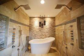 Walk in tile shower with modern subway tile, large white tile shower with glass door and niche in shower, neutral tile shower. Large And Luxurious Walk In Showers Hgtv