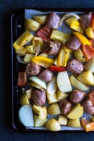Sheet Pan Sausage Peppers Potatoes This Recipe Takes One Sheet Pan And Only A Handful Of Ingredie Thanksgiving Ingredients Stuffed Peppers Weeknight Meals