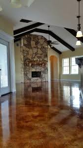 Rustic Living Room With Abundant Natural Light Flagstone Wood Burning Fireplace Stained Co Brick Fireplace Makeover Fireplaces Layout Concrete Stained Floors