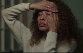 What character holds something yellow in the storage room?