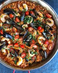 Authentic Seafood Paella Recipe With Saffron Hip Foodie Mom Recipe Paella Recipe Seafood Paella Recipe Seafood Paella