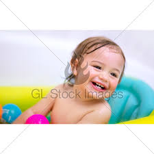 Newborn infant baby getting his first bath in the hospital. Sweet Child Taking Bath Gl Stock Images