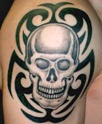 The deer skull tattoo on the shoulder. 40 Tribal Skull Tattoos Ideas