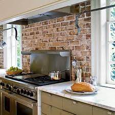 A stone tile backsplash completes the suggestion of a fireplace and mantle. Modern Colonial Kitchen Colonial Kitchen Remodel Modern Colonial Kitchen Kitchen Remodel