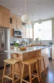 Hands down the best cabinet choice for a timeless kitchen is white. My Sister S New Kitchen Surprise It S Not White Or Subway Tile Kitchen Design Maple Kitchen Cabinets Kitchen Remodel