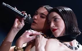 Dua lipa, whose pop music has found an enthusiastic audience amid the pandemic, brought dance moves and da baby to the grammys stage to perform her hits levitating and don't start now complete with a moon backdrop, sequined attire and captivating choreography. St Vincent And Dua Lipa S Incredible Grammys Performance Was Queer Af