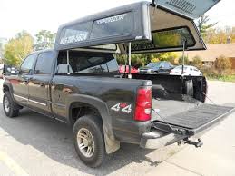 The truck campers are larger and more expensive than canopies or truck bed tents. Topperezlift Gallery A R E Truck Caps And Tonneau Covers Truck Accessories Truck Canopy Truck Bed Covers