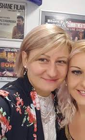 This is my friend, she passed away last week😭 Can you change background  and remove her colegue. I would like to use that picture to stay near  coffin 😭😭🥺🥺 Many thanks