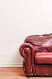 Loveseat is the best way to buy vintage chairs in san diego, los angeles & orange county. Luxurious Red Leather Couch In Front Of A Blank Wall Stock Photo C Benoit Daoust Aetb 4537189 Stockfresh
