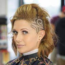 It doesn't feature any designs and similar to a mohawk, but it doesn't need to because it creates a beautiful contrast. 20 Cute Shaved Hairstyles For Women