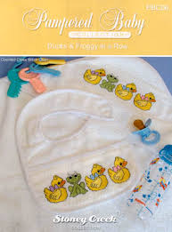 Quick and easy baby bib knit in seed stitch with a cable up one side that becames the loop that holds the bib on. Ducks Frogs In A Row Books And Charts By Designer Stoney Creek Robin S Nest Designs