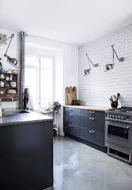 We have all seen beautiful pictures of kitchens without upper cabinets but they are usually on an exterior wall. Kitchens Without Upper Cabinets Should You Go Without Apartment Therapy