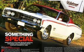 Cale yarborough poses with the 1969 mercury cyclone out of the wood brothers' stables before the firecracker 400 at daytona. 1969 Cale Yarborough Mercury Cyclone Spoiler