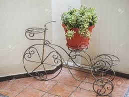 Antique ceramic jardinière plant stand, bowl, blue and white, birds, circa 1890. Decorative Wrought Iron Flower Stand In The Shape Of A Bicycle Stock Photo Picture And Royalty Free Image Image 150699252