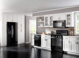 How To Decorate A Kitchen With Black Appliances Black Appliances Kitchen Kitchen Cabinets With Black Appliances White Cabinets Black Appliances