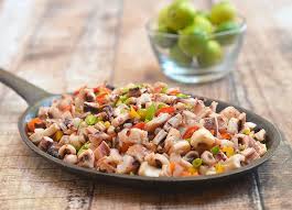 Spicy Full Flavored And Chockful Of Onions And Bell Peppers This Sisig Pusit Makes A Delicious Appetizer Or A Sat Asian Food Appetizers Stuffed Peppers Sisig