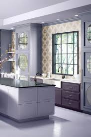 This orange colored kitchen maybe flashy but sure is catchy! Eggplant And Lilac Kitchen Paint Color Ideas Kitchen Interior Design Modern Kitchen Paint Colors Interior Design Kitchen