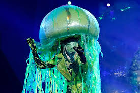 Given the jellyfish's clear vocal talent, many assumed a singer was swimming beneath the lime green costume. Who Is Jellyfish On The Masked Singer Clues Point To This Top Athlete Singer Angel Movie Jellyfish