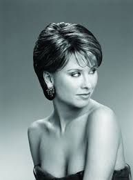 This hairstyle is achieved with a styling brush and a blow dryer, with one side of the hair being tucked behind the ear. Bob Haircut Behind Ears Novocom Top