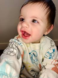 Barber using WWII German helmet for haircuts in 1977