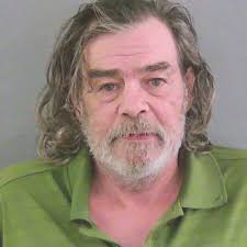 Man whose car broke down arrested after found drinking wine in parking lot 