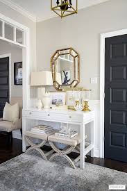 An intersecting steel base adds modern flair to the tufted cushion top. 520 Entrance Inspiration Ideas In 2021 Home House Design Beautiful Lighting
