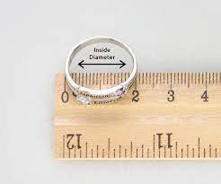 Step 1 wrap a flexible tape measure around your ring finger to find the size of your finger, in centimeters. How To Measure Your Ring Size My Name Necklace Canada