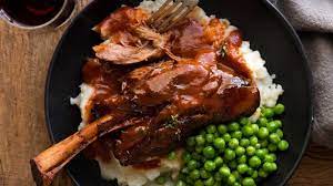 These Slow Cooked Lamb Shanks Are Meltingly Tender And Are Braised In A Rich Red Wine Sauce Super Easy T Slow Cooked Lamb Slow Cooked Lamb Shanks Lamb Recipes