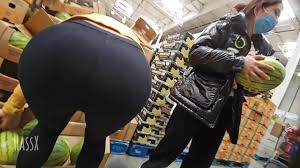 UPSKIRT bare pussy as she bends over- exposed in a store