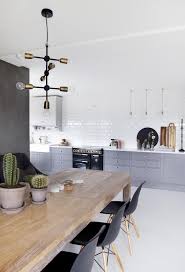 Modern Industrial Kitchen With Gray Cabinets And Mid Century Modern Chairs Home Decor Kitchen Home Kitchens Scandinavian Kitchen Design