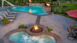 Turn your backyard into a cozy camp spot by making your own fire pit. Fire Water Combo In 15 Traditional Pools With Fire Pits Home Design Lover