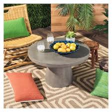 Give any room a focal point with this stylish coffee table from safavieh, featuring a combination of wood and concrete for a contemporary look. Delfia Modern Concrete Round Dia Coffee Table Dark Gray Safavieh Outdoor Coffee Tables Garden Coffee Table Industrial Coffee Table