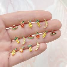 If your engagement ring or new necklace starts turning your skin green, it does not necessarily mean the metal quality is poor. 2021 S925 Anti Allergy Post 18k Gold Plated Zircon Studs Fashion Crystal Pineapple Banana Peach Apple Lemon Fruit Stud Earrings From Best4goods 1 26 Dhgate Com