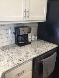 A grey and white granite with spots of black. 7 White Ice Granite Ideas White Ice Granite Kitchen Remodel Granite Kitchen