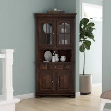 The hutch offers open and concealed storage with 5 small cubbies, shelving space behind 2 sliding doors and a fabric pin board across the bottom. Carlinville Rustic Solid Wood Glass Door Corner Hutch