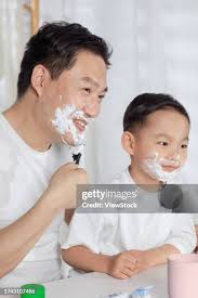 987 Son Imitating Father Stock Photos, High-Res Pictures, and Images