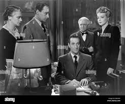 SALLY SCHÄFERHUND HENRY DANIELL BASIL RATHBONE DIE FRAU IN GRÜN (1945  Stockfotografie