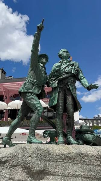 Bronze statue of Jacques Balmat pointing the way to climb Mont Blanc to Horace Benedict de Saussure. Balmut was the intrepid guide who achieved the first ascent of Mont Blanc in August 1786 Saussure ...