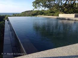 Infinity Edge Pool Granite Coping Landscape Architecture By Stephen Stimson Associates Pool Water Features Outdoor Water Features Swimming Pool Designs